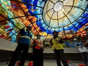 State officials give reporters a behind-the-scenes tour of a new stained glass laylight that was recently installed in the Utah Capitol's new north building as construction nears completion at the Utah Capitol's complex in Salt Lake City on May 19, 2025. (Katie McKellar / Utah News Dispatch)